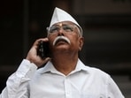File photo: A man looks at a screen outside the Bombay Stock Exchange (BSE) building in Mumbai