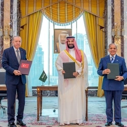 Turkish President Tayyip Erdogan, Saudi Crown Prince Mohammed bin Salman and Pakistan's Prime Minister Shehbaz Sharif pose after signing a joint defence agreement in Mecca, Saudi Arabia, August 7,