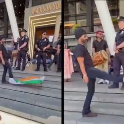 It appears as if the man has wrapped part of the national flag to his shoes, while continuously flaring and kicking the rest. 