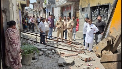 Police during the demolishing drive in Ludhiana on Monday. (HT Photo)