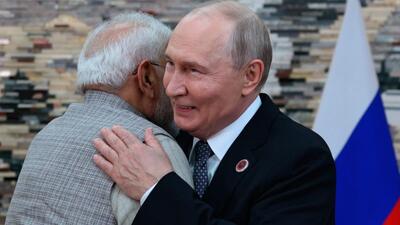 Russian President Vladimir Putin, right, and Prime Minister Narendra Modi embrace each other during their meeting on the sidelines of the SCO in Bishkek, Kyrgyzstan, on Monday. (Pyotr Kovalev/Pool Sputnik Kreml)