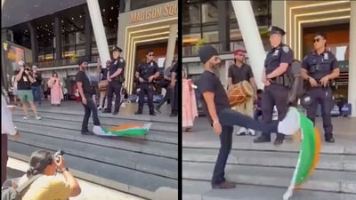 It appears as if the man has wrapped part of the national flag to his shoes, while continuously flaring and kicking the rest. (Screengrab/X/@KirenRijiju) It appears as if the man has wrapped part of the national flag to his shoes, while continuously flaring and kicking the rest. (Screengrab/X/@KirenRijiju)