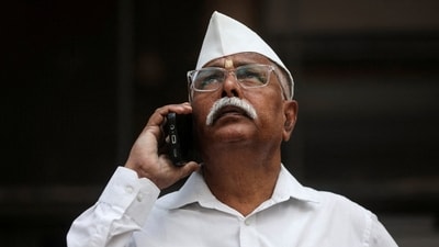 File photo: A man looks at a screen outside the Bombay Stock Exchange (BSE) building in Mumbai
