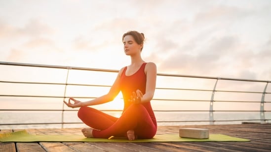Busy professionals can take out time before or after work and do yoga. (Picture credit: Freepik)