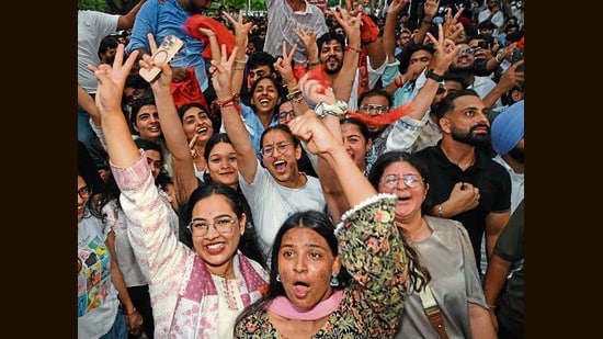ABVP supporters celebrating after Ankit Bidhan won the presidential election of PUCSC in Chandigarh on Monday. (Ravi Kumar/Hindustan Times)