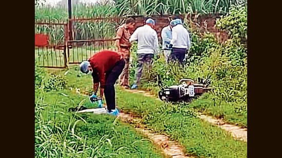 Forensic team and police personnel inspect the encounter site in Shamli on Monday. (HT Photo)