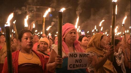 Imphal: Women take part in protest rally 'Meira Rally' as they hold flame torches demanding updation of the National Register of Citizens (NRC) before the Census in Manipur, at Khurai area, in Imphal on Aug. 21 (PTI FILE)