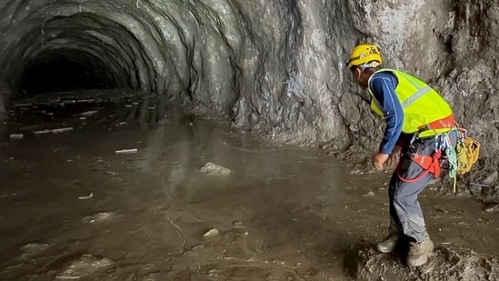 Nepal floods LIVE: A rescuer works at the entrance of a tunnel at Chilime Hydropower Plant as rescue operations continue for people trapped inside following deadly flash floods and a mudslide, in Rasuwa, Nepal.