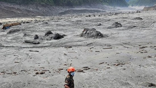 Nepal floods LIVE: A Nepal Army soldier works during a search and rescue operation near the Trishuli Hydropower Project site, following deadly flash floods and mudslides, in Rasuwa district.
