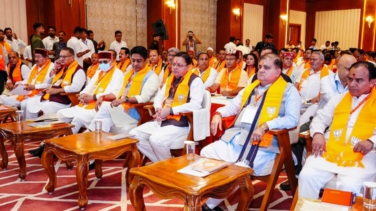Uttarakhand CM Pushkar Singh Dhami and others listen to Prime Minister Narendra Modi's 'Mann Ki Baat' radio programme. 