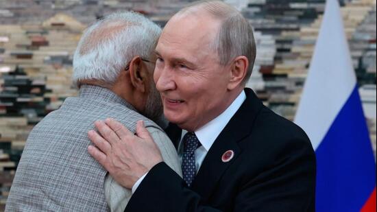 Russian President Vladimir Putin, right, and Prime Minister Narendra Modi embrace each other during their meeting on the sidelines of the SCO in Bishkek, Kyrgyzstan, on Monday. (Pyotr Kovalev/Pool Sputnik Kreml)