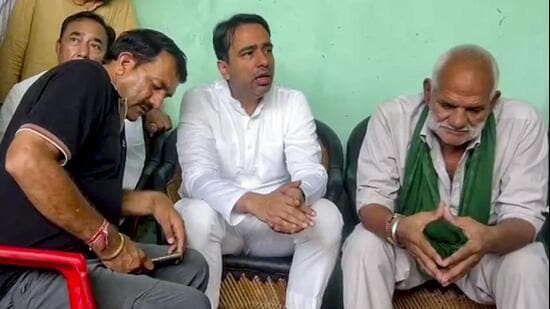Union minister Jayant Chaudhary meeting the family members of Ankit Balyan at Bantikheda village in Shamli on Monday. (Screengrab via PTI)