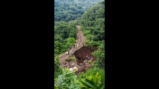 Workers carry out restoration and repair work on the UNESCO World Heritage Kalka-Shimla railway track near Parwanoo, in Solan district, Himachal Pradesh, on Monday. (PTI)