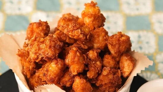 Chef Sanjeev Kapoor's air-fried chicken popcorn recipe takes only half an hour to make.