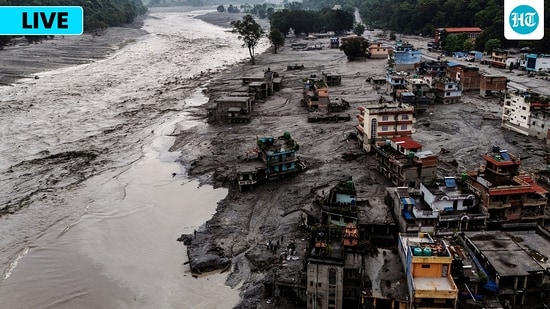 A drone view shows damaged buildings and houses covered in mud next to the Likhu River following deadly flash floods and mudslides, in Devighat, Nuwakot district, Nepal.