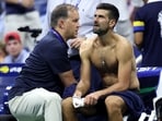 Novak Djokovic of Serbia receives treatment in his match against Mariano Navone of Argentina during their Men's Singles First Round match on Day One of the 2026 US Open