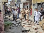 Police during the demolishing drive in Ludhiana on Monday. (HT Photo)