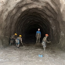 Rescue personnel work at a hydropower tunnel site, in the aftermath of deadly flash floods and a mudslide, in Rasuwa district, Nepal.
