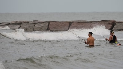 The National Hurricane Center reported that Edouard was located about 15 miles (25 kilometers) south-southeast of Port Arthur, Texas. (Brett Coomer/Houston Chronicle v) The National Hurricane Center reported that Edouard was located about 15 miles (25 kilometers) south-southeast of Port Arthur, Texas. (Brett Coomer/Houston Chronicle v)
