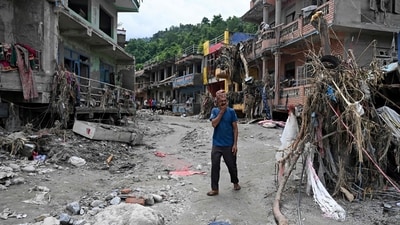 A man walks past damaged houses following flash floods at Devighat in Nepal's Nuwakot district. (AFP) A man walks past damaged houses following flash floods at Devighat in Nepal's Nuwakot district. (AFP)
