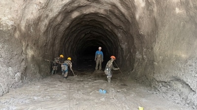 Rescue personnel work at a hydropower tunnel site, in the aftermath of deadly flash floods and a mudslide, in Rasuwa district, Nepal. (via Reuters)