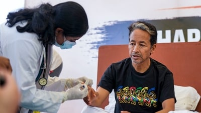 Sonam Wangchuk being attended by a medical professional during a protest by Cockroach Janata Party (CJP) at the Jantar Mantar in New Delhi. (PTI File) Sonam Wangchuk being attended by a medical professional during a protest by Cockroach Janata Party (CJP) at the Jantar Mantar in New Delhi. (PTI File)