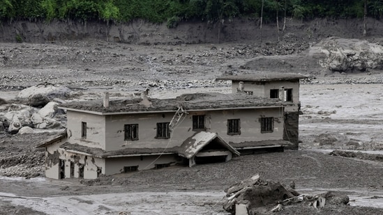 A mud-covered building following a flash flood at Trishuli in Nuwakot district, Nepal, August 26, 2026. 