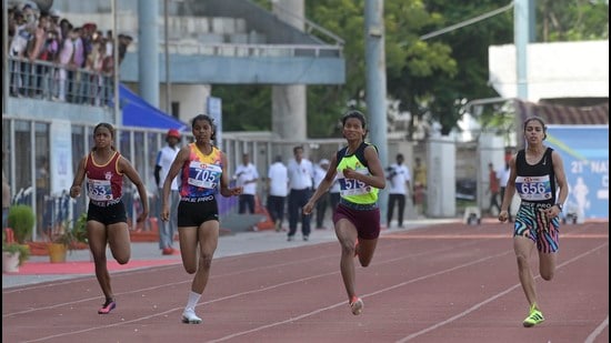Players in action during the 100 metre race at Guru Nanak Stadium in Ludhiana on Tuesday. (Gurpreet Singh/HT)