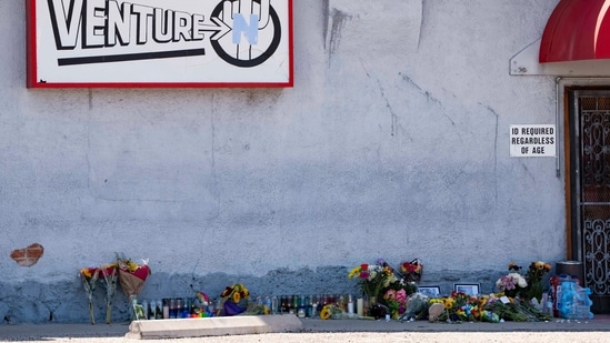 A growing memorial sits outside the Venture-N Bar in Tucson, Ariz., Tuesday, Sept. 1, 2026, for Vincent Siquieros and Cameron Capara, who were fatally shot in the parking lot of the gay bar shortly after midnight Monday. (AP Photo/Rebecca Noble)(AP Photo/Rebecca Noble)