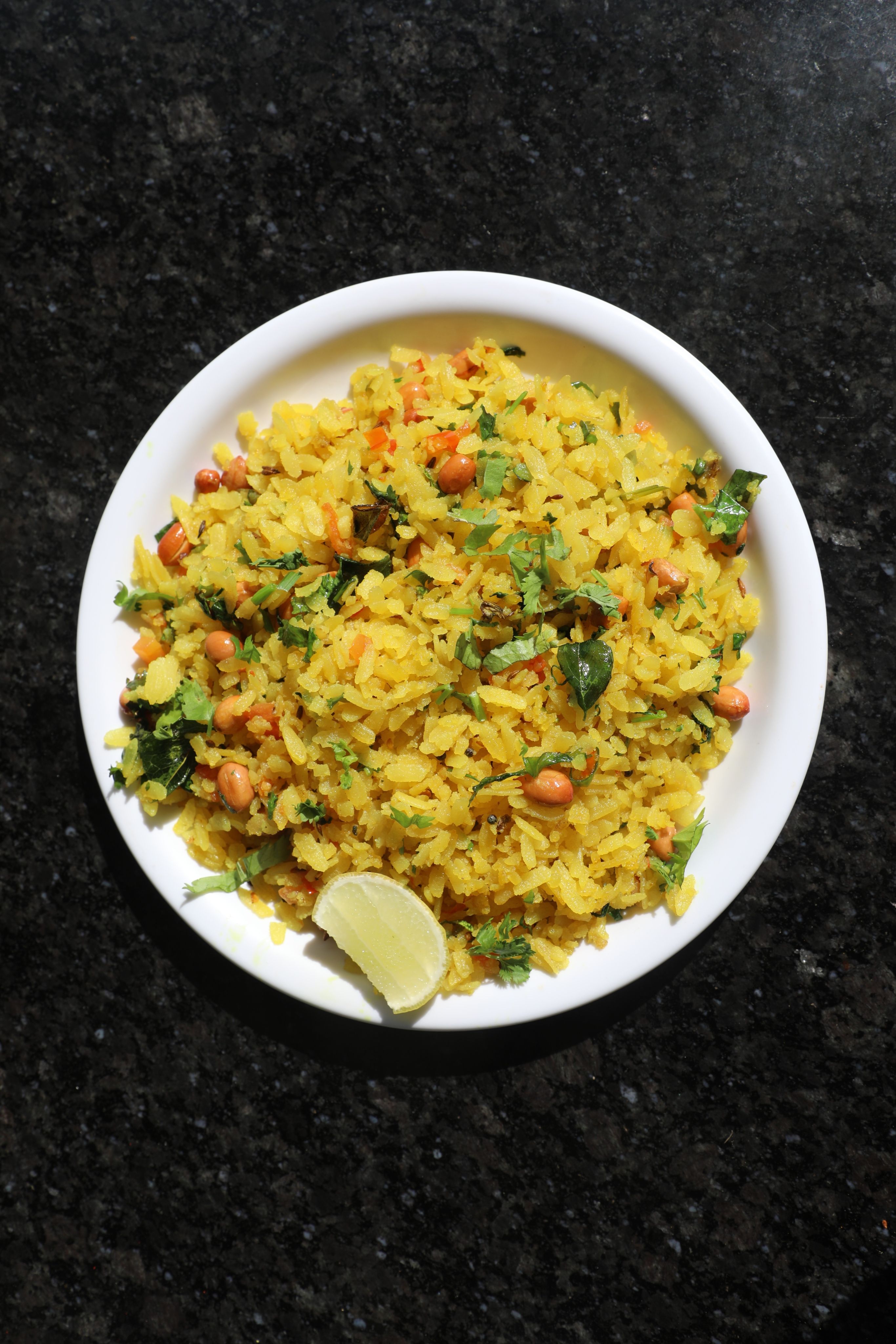 A bowl of plain poha with some onion and coriander may be delicious, but it isn't giving you much protein. (Pexel)