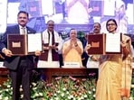 CM Yogi Adityanath witnesses the exchange of an MoU between the UP government and SBI at the launch of UPCOS, in Lucknow on Wednesday. (ANI)