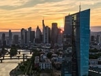 The sun has set behind the buildings of the banking district and the European Central Bank, right, in Frankfurt, Germany, Tuesday, Sept. 1, 2026. 