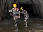 Nepali soldiers conducting an operation inside a tunnel to rescue workers after flash floods at the Rasuwagadhi Hydropower Project site in Rasuwa district. 