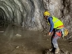 A rescuer works at the entrance of a tunnel at Chilime Hydropower Plant as rescue operations continue for people trapped inside following deadly flash floods and a mudslide, in Rasuwa, Nepal. 