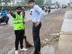 PMC additional commissioner Prajit Nair and deputy commissioner Santosh Warule inspect garbage lifting work.