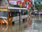 Passengers look out from inside a UPSRTC bus stranded at a waterlogged underpass following heavy rain, in Mirzapur, Tuesday. Passengers look out from inside a UPSRTC bus stranded at a waterlogged underpass following heavy rain, in Mirzapur, Tuesday.
