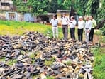 The collected footwear is currently stored at a vacant plot at Saibaba Municipal School in Parel.