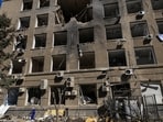 A worker removes debris in front of a building of a business centre hit by a Russian drone strike, amid Russia's attack on Ukraine, in Odesa, Ukraine September 2, 2026. 