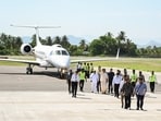Tamil Nadu Chief Minister C. Joseph Vijay waves as he arrives at the airport for the opening of the sluice gates of the Stanley Reservoir for irrigation in the Cauvery delta districts at Mettur, in Salem on Tuesday. 