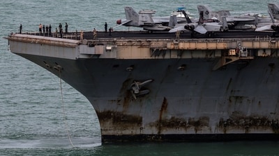 The U.S. Navy Nimitz-class aircraft carrier USS Abraham Lincoln sails toward Laem Chabang Port before docking for a rest stop following a long deployment in the Middle East. (REUTERS)