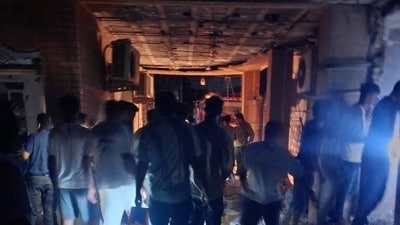 People gather at the site in the aftermath of a reported attack in Kuhistik, Sirik, Iran, September 1, 2026. 