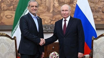 Russia's President Vladimir Putin and Iran's President Masoud Pezeshkian shake hands during a meeting on the sidelines of the Shanghai Cooperation Organisation (SCO) summit in Bishkek on September 1, 2026. (AFP)