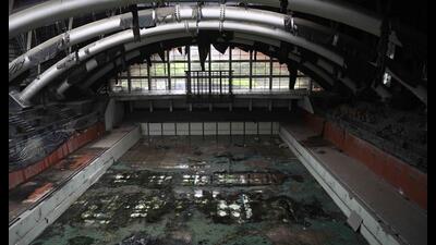 The swimming pool presented another picture of neglect. The area’s ceiling showed signs of leakage, while mud had accumulated over the pool tiles. (Deepak Gupta/HT Photo)