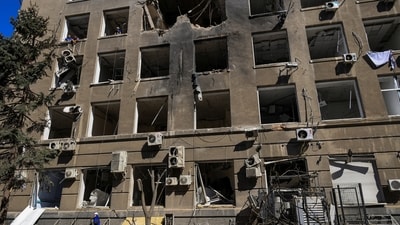 A worker removes debris in front of a building of a business centre hit by a Russian drone strike, amid Russia's attack on Ukraine, in Odesa, Ukraine September 2, 2026. (REUTERS)
