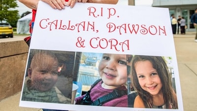 A woman carries a sign to show support for the three murdered children of Lindsay Clancy during the Clancy's murder trial at Plymouth Superior Court in Plymouth, Massachusetts on September 1, 2026. (Photo by JOSEPH PREZIOSO / AFP) (AFP) A woman carries a sign to show support for the three murdered children of Lindsay Clancy during the Clancy's murder trial at Plymouth Superior Court in Plymouth, Massachusetts on September 1, 2026. (Photo by JOSEPH PREZIOSO / AFP) (AFP)