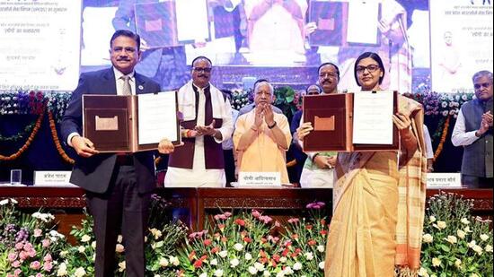CM Yogi Adityanath witnesses the exchange of an MoU between the UP government and SBI at the launch of UPCOS, in Lucknow on Wednesday. (ANI)