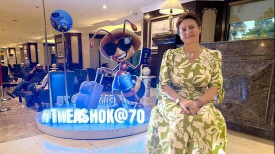 Diana Mickevičienė, Lithuania’s ambassador to India poses with The Ashok’s 70th anniversary cartoon. (HT Photo)