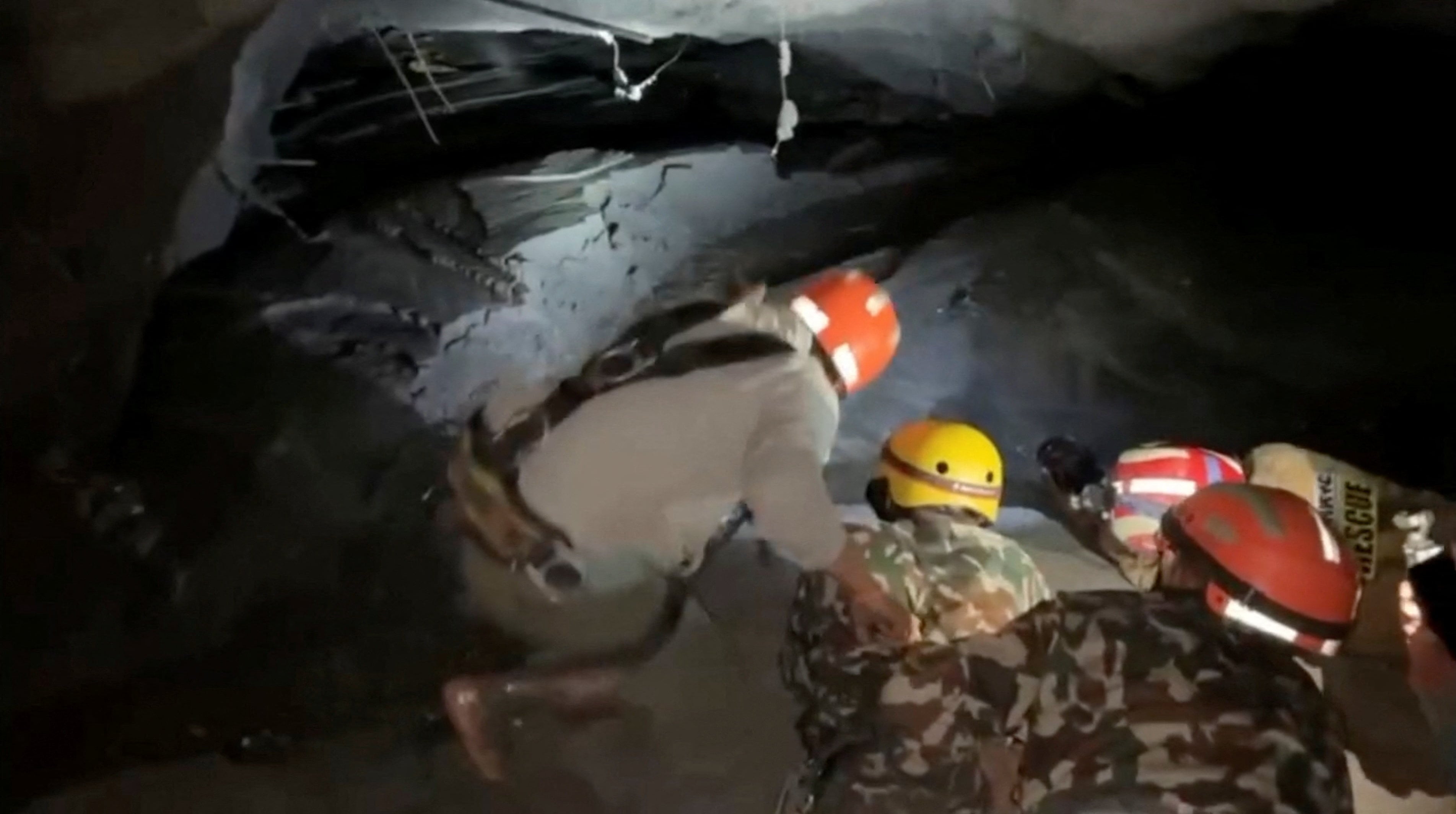 Rescue personnel search for victims inside the Rasuwagadhi Hydropower Project tunnel. (REUTERS)