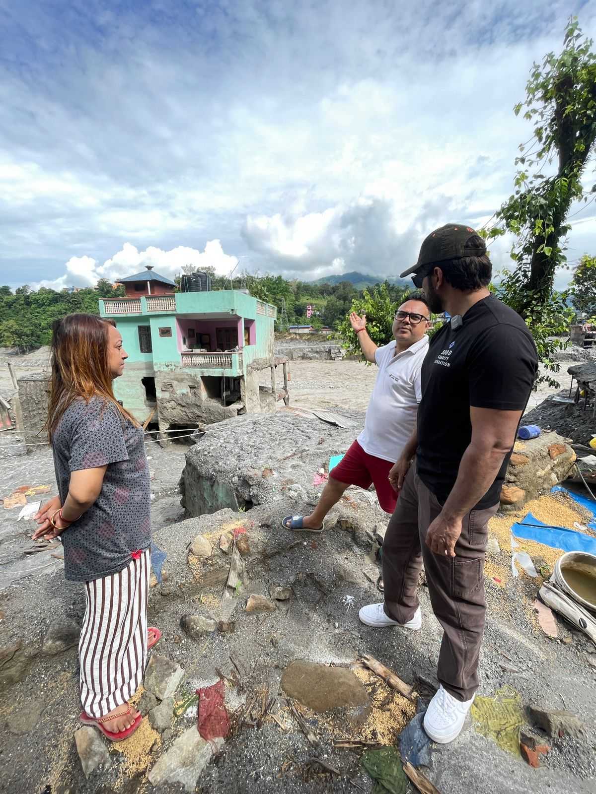 Sonu Sood meets the people living in the miracle green house which survived the floods. Sonu Sood meets the people living in the miracle green house which survived the floods.