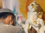 A Pakistani artist painting a Ganapati idol. 